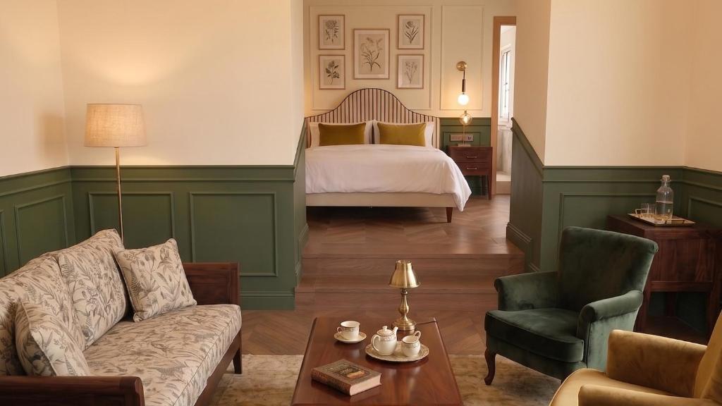 A BV House suite — green panelling, botanical prints and a quiet sitting corner